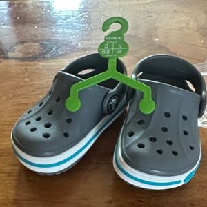 CROCS Kids Gray Clogs with Blue Stripe